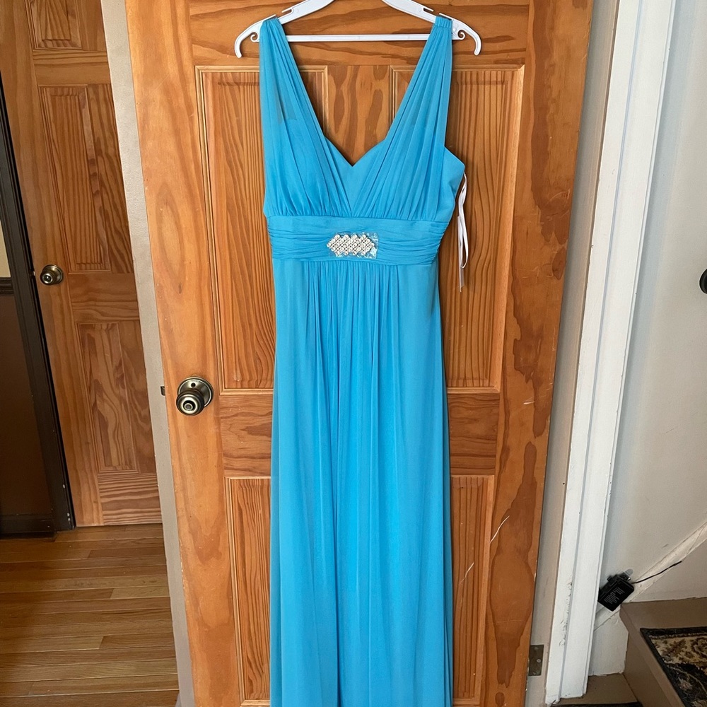 Prom/dressy attire floor length blue dress. Medium, new with tags, never worn.